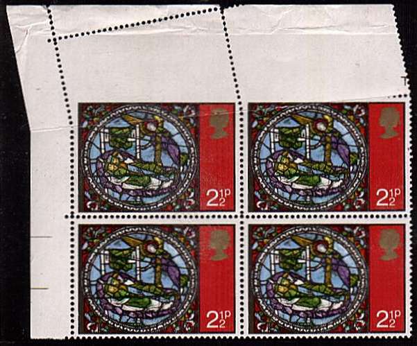 view larger image for SG 894var (1971) - 2½p Christmas - Stained Glass Window in an unmounted mint NW corner block of four showing a huge paper fold affecting top two stamps resulting in the stamps being imperforate between stamps and margin. Pretty!
